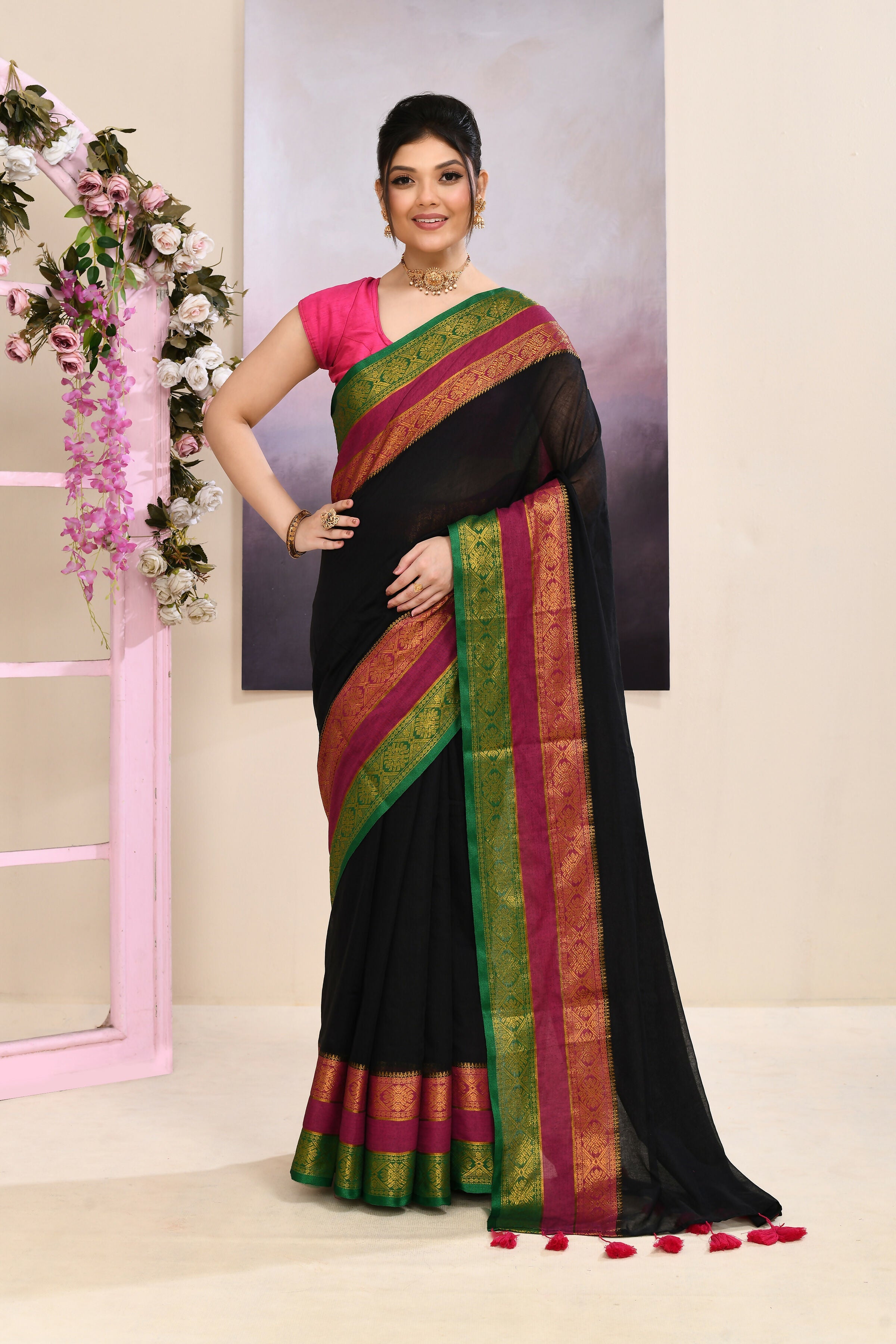 Black embellished cotton saree with a golden zari border.
