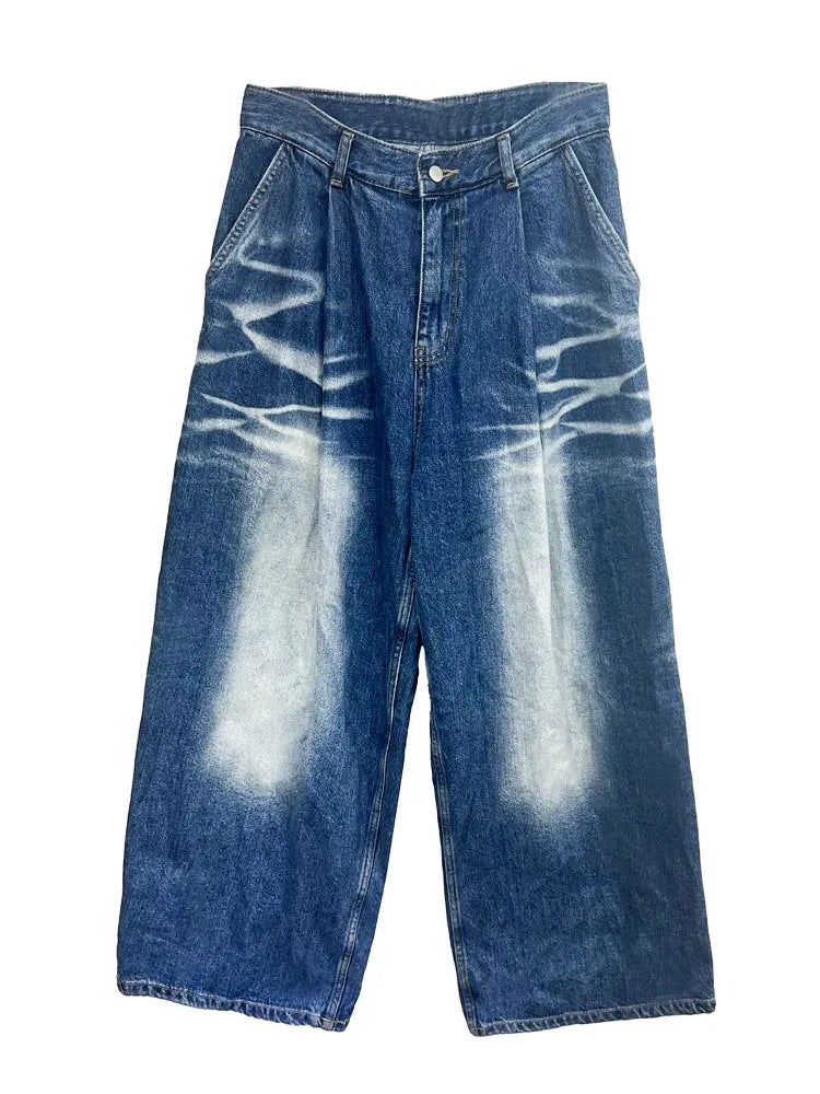 A pair of Classic Blue Harajuku style loose pleated wide leg jeans with tie-dye fade details, featuring a high waist and denim texture.