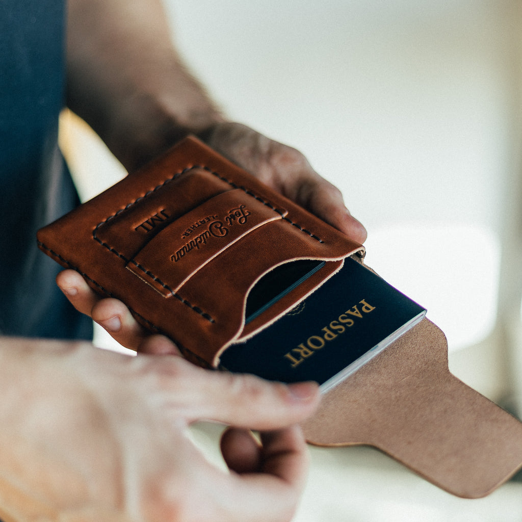The Huckleberry standard brown passport wallet showing interior card and passport slots