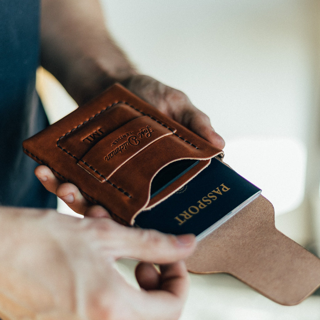 The Huckleberry standard brown passport wallet showing interior card and passport slots