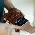 The Huckleberry standard brown passport wallet showing interior card and passport slots
