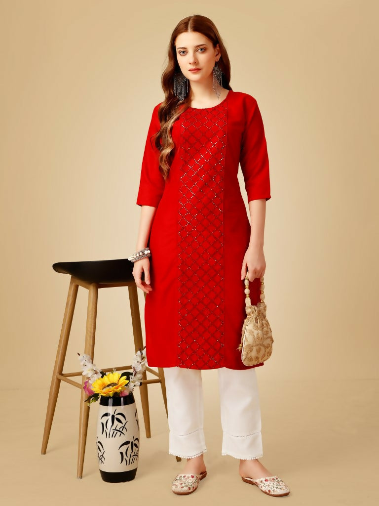 Women wearing a bright red embroidered cotton blend straight kurta with matching pants