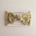 Willow Stripe Ribbed bamboo baby head wrap featuring a knotted bow design on a display card