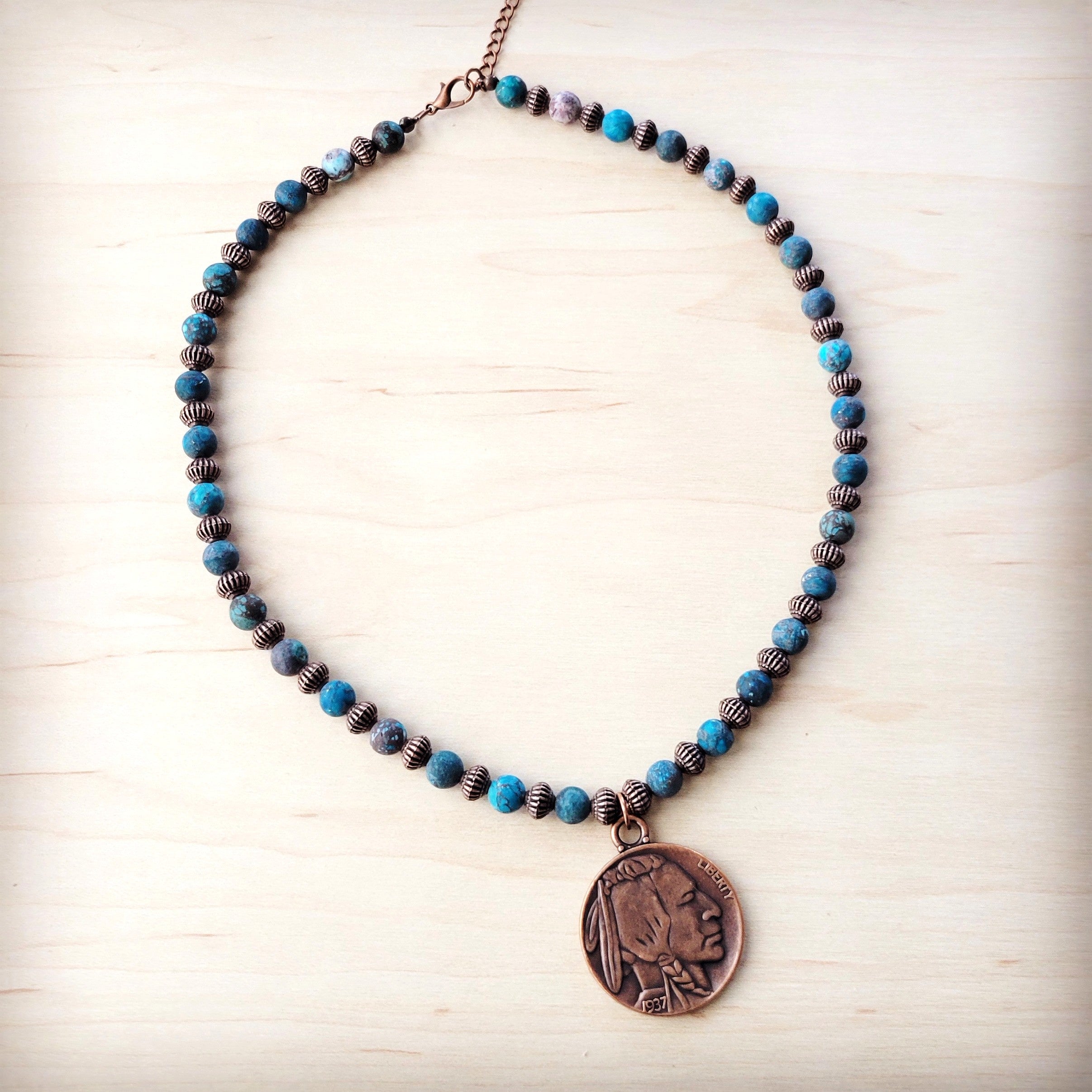 Natural turquoise bead necklace with copper-tone spacer beads and a bronze-toned Indian Head coin pendant.