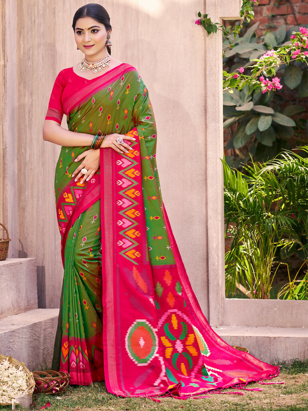 Mehandi green Pochampally silk saree featuring traditional weave patterns.