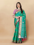 Teal soft silk saree featuring traditional Patola weaving with rich golden zari border and pallu