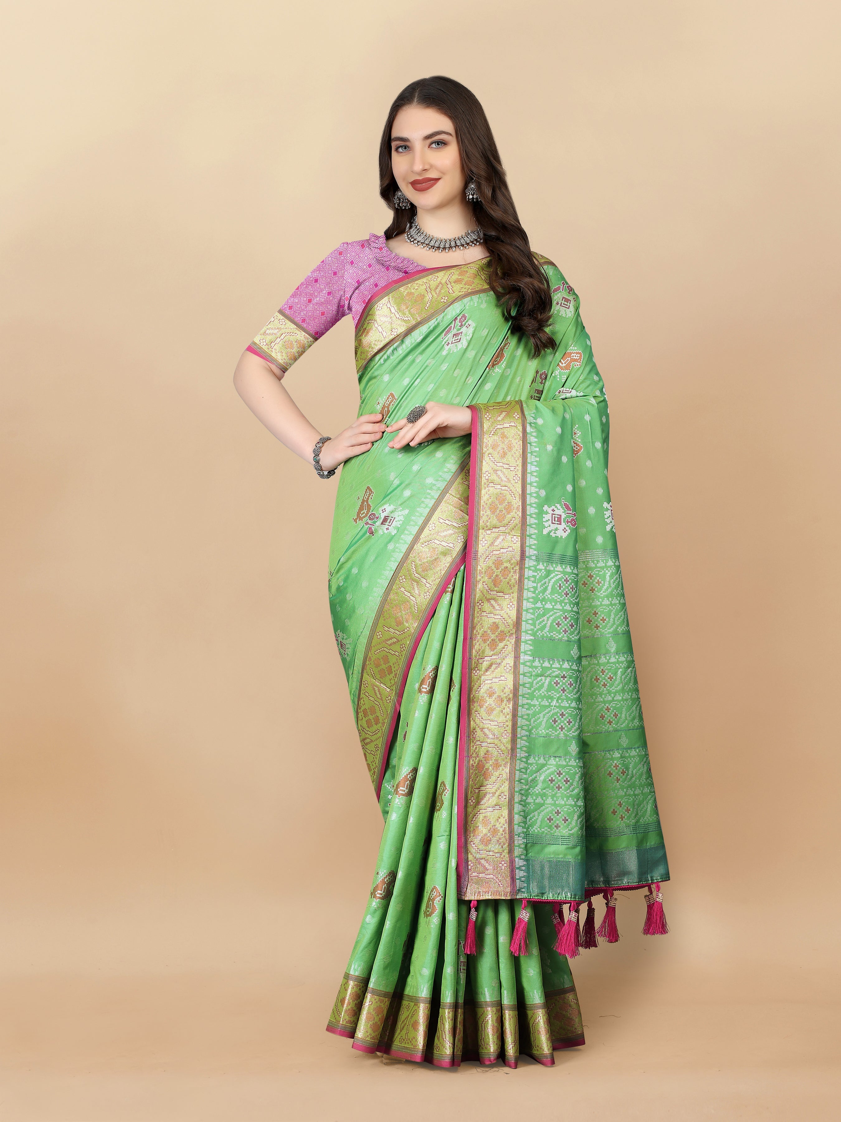 Parrotgreen soft silk saree with intricate Patola weaving and rich golden zari border and pallu