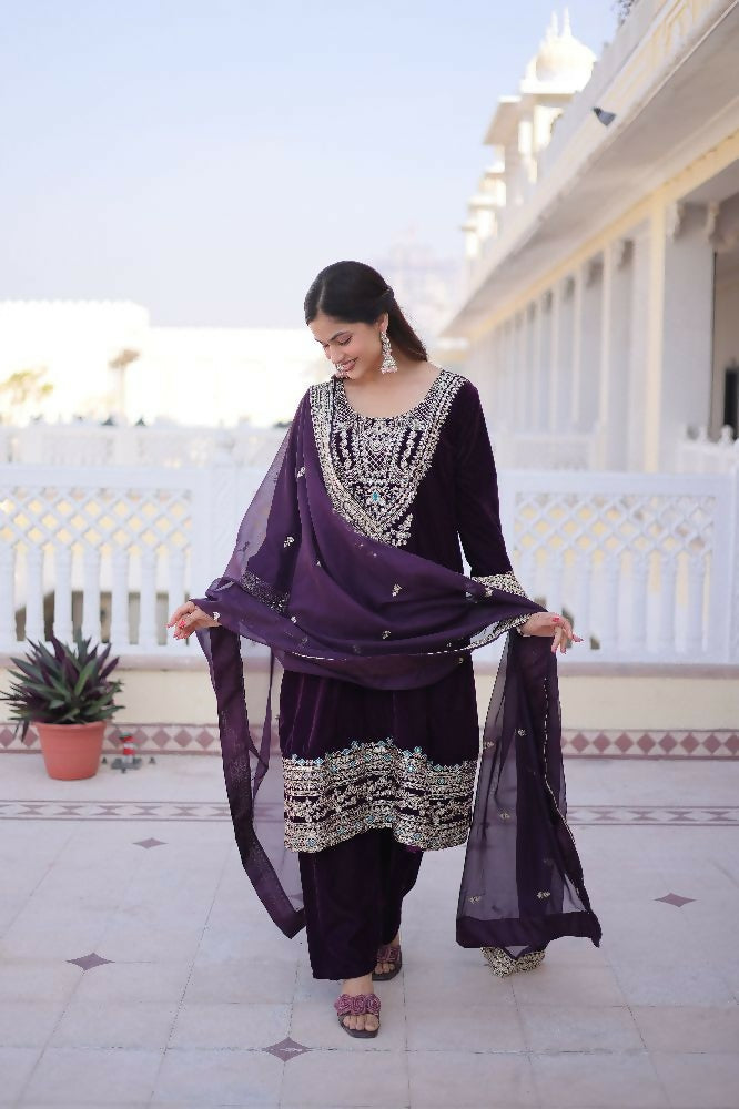 Elegant wine velvet kurta set with intricate sequins, zari, and thread embroidery details.