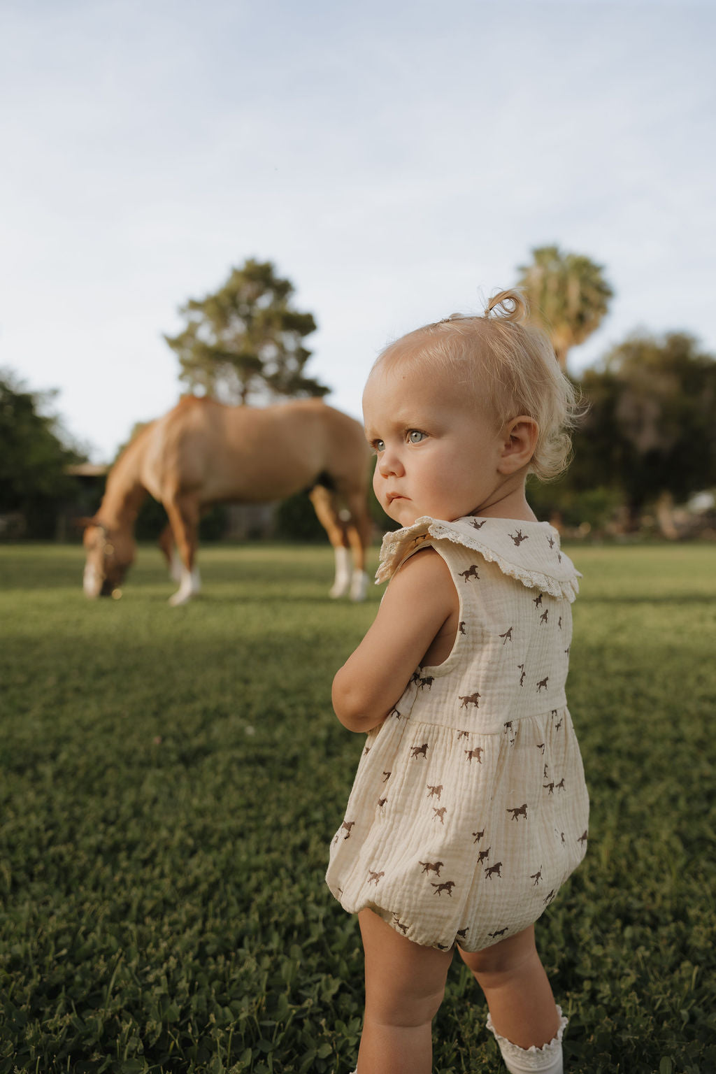 Wild Horses Muslin Baby Romper in Cream Cotton - Image 2