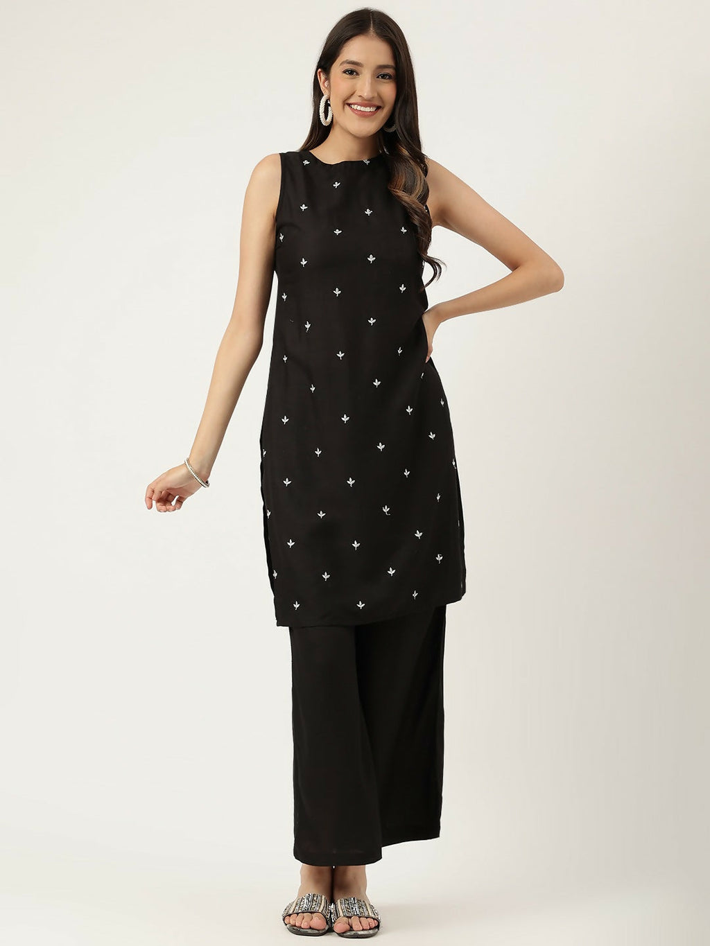 A sophisticated black rayon straight kurta set featuring elegant embroidered detailing and matching bottoms.