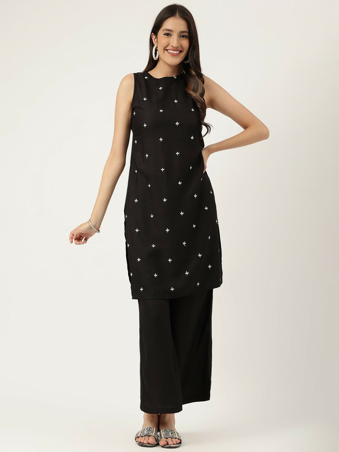 A sophisticated black rayon straight kurta set featuring elegant embroidered detailing and matching bottoms.