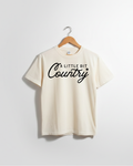 Little Bit Country kids graphic tee in solid cotton, available in white, black, and cream.