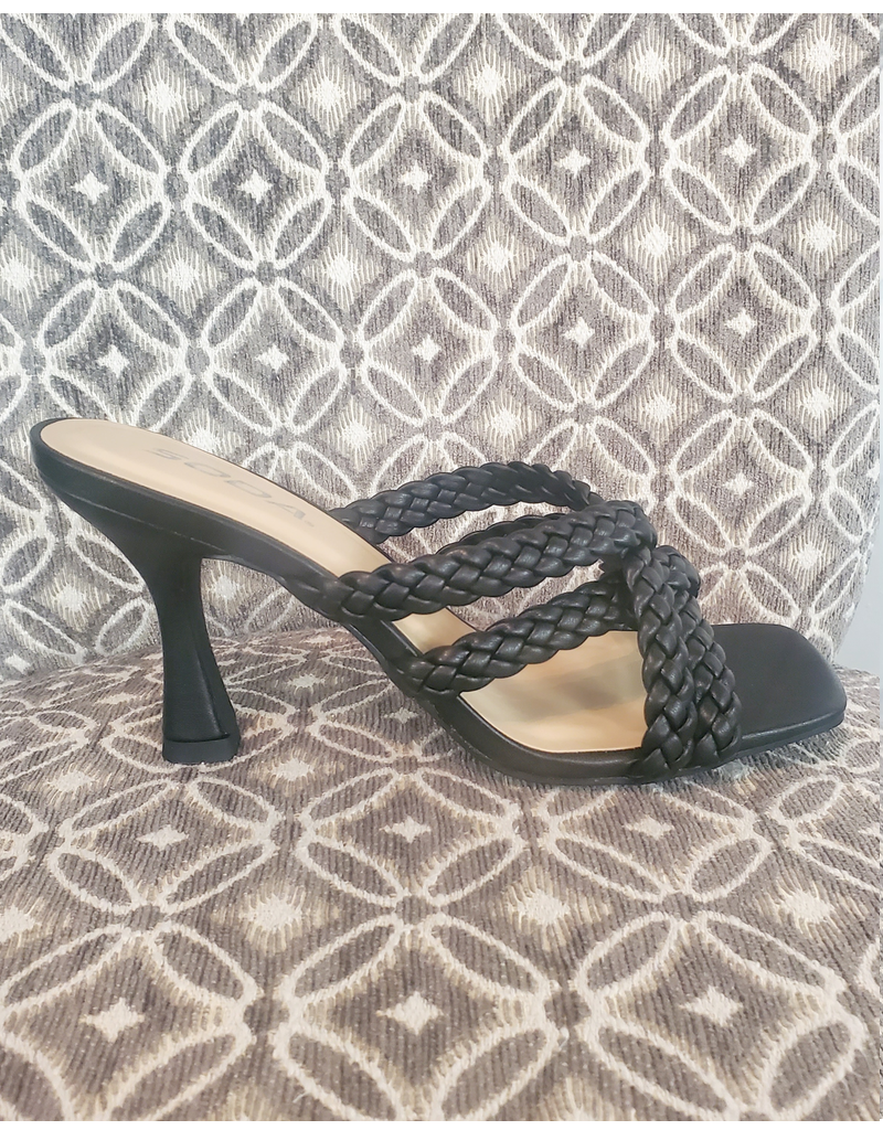 Pair of Kellan Sandals by Boutique 23 shown from the side in a lifestyle setting.