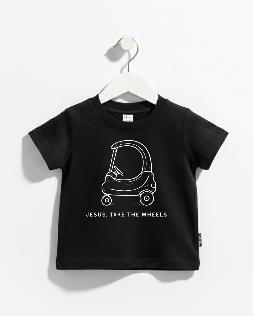 Kids graphic t-shirt in red featuring a Cozy Coupe car and the text Jesus Take the Wheels.