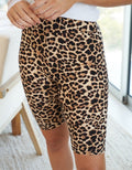 High-rise cheetah print knit biker shorts in warm tan and black, bodycon athletic style
