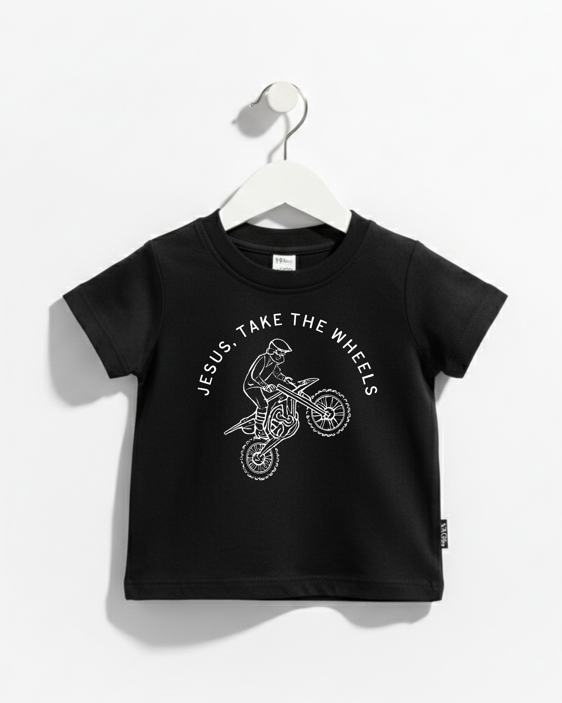 Kids wearing the Jesus Take the Wheels dirt bike graphic cotton tee.