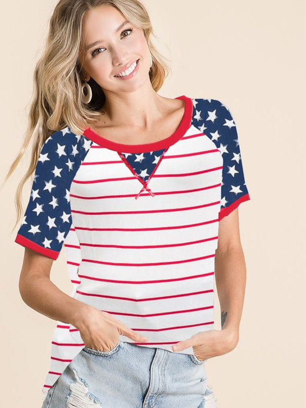 A woman wearing a relaxed fit, short-sleeve knit tee with red, white, and blue patriotic stripes and star print.