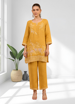 Mustard linen cord set featuring intricate embroidery and a split V-neck top