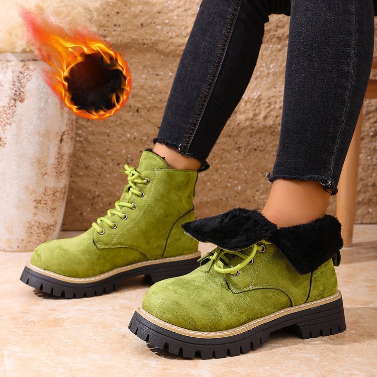 A pair of olive green lace-up ankle boots with black fleece lining and a chunky lug sole.