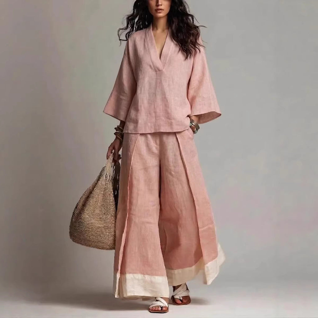 Woman wearing a bohemian two-piece linen blend set with V-neck top and wide-leg pants in soft pastel colors.