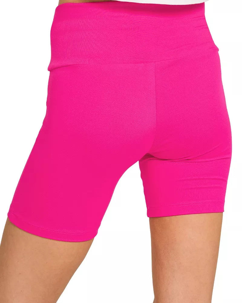 Hot pink shorts on a white background