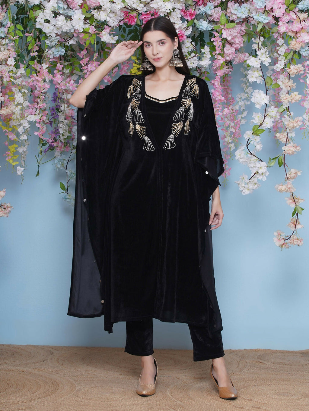 Black velvet kaftan with intricate hand embellishments, including matching inner and pant.