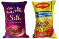Reversible novelty throw pillows featuring Cadbury Dairy Milk Silk and Maggi packaging designs.