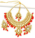 Exquisite handmade gold-plated Kundan jewellery set featuring vibrant red stones