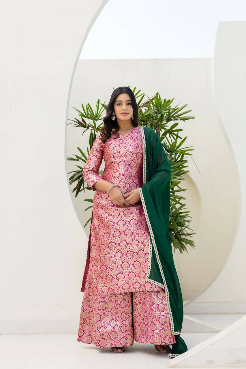 Woman wearing a pink jacquard embroidered kurti and sharara pant set