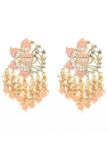 Close-up of gold-polished peach Meenakari Kundan earrings for festive occasions