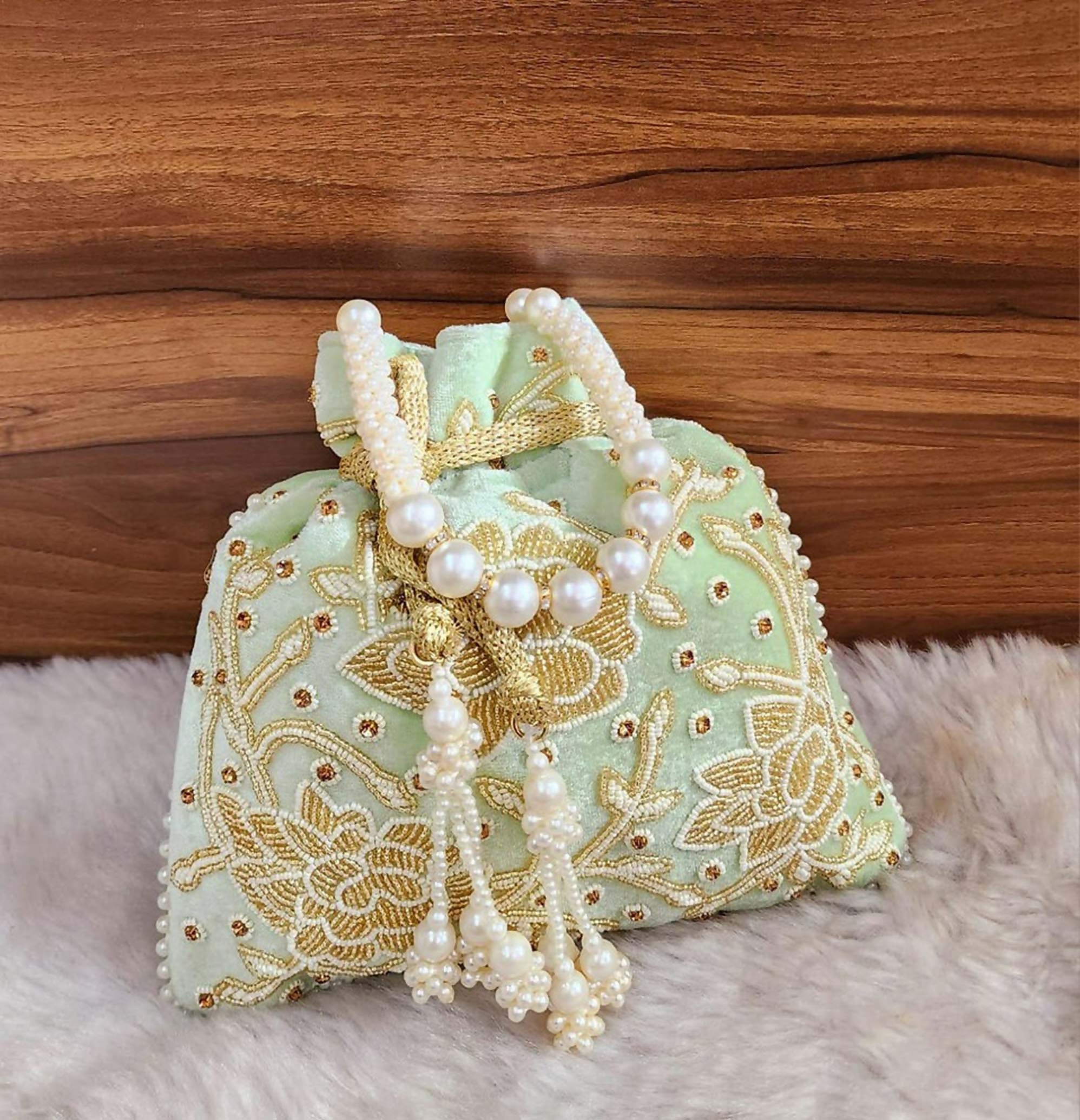 Light green synthetic potli bag for ethnic festivities