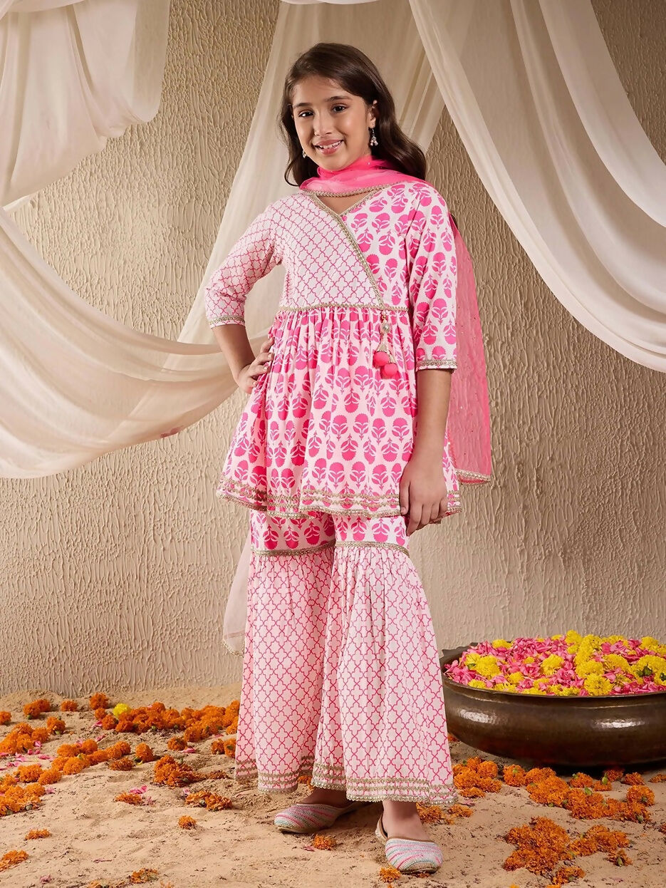 Girl wearing a pink cotton sharara set with traditional ethnic design
