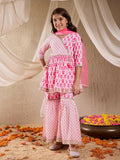 Girl wearing a pink cotton sharara set with traditional ethnic design