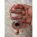 Silver bangle with orange pearls and hanging jhumka details
