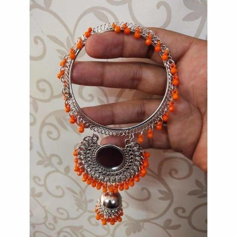 Silver bangle with orange pearls and hanging jhumka details