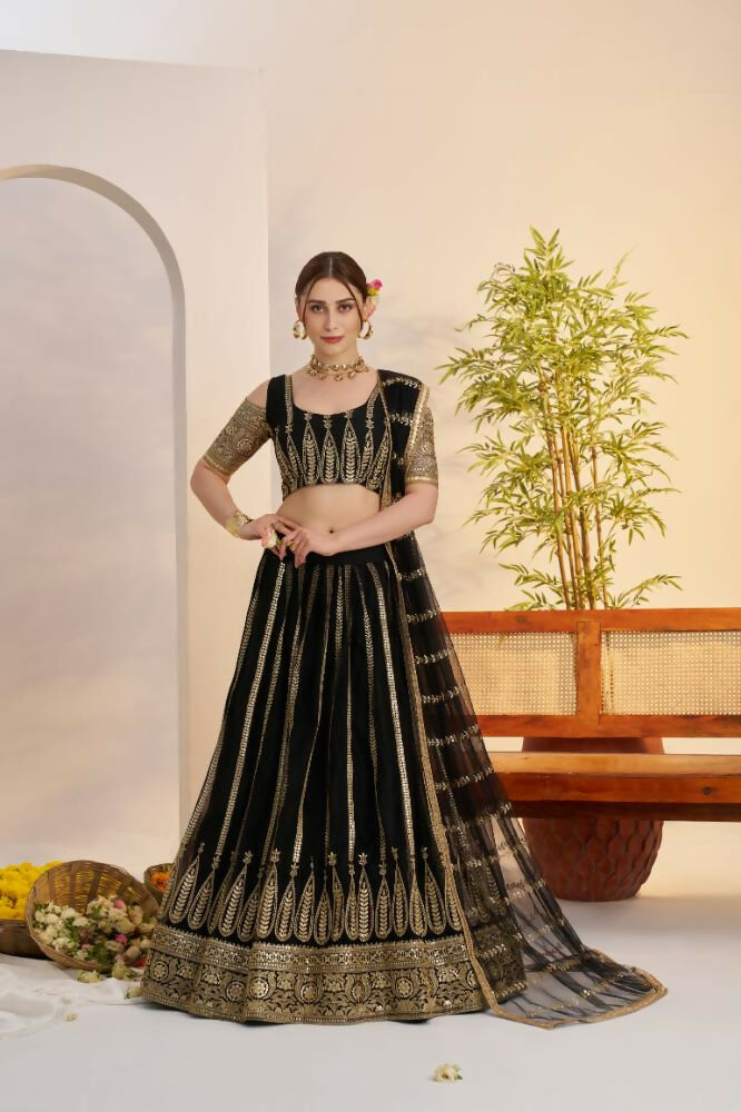 Black Butterfly Net lehenga featuring intricate zari and sequence work embroidery.