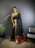 A graceful black Bhagalpuri cotton silk saree with white box and stripe patterns