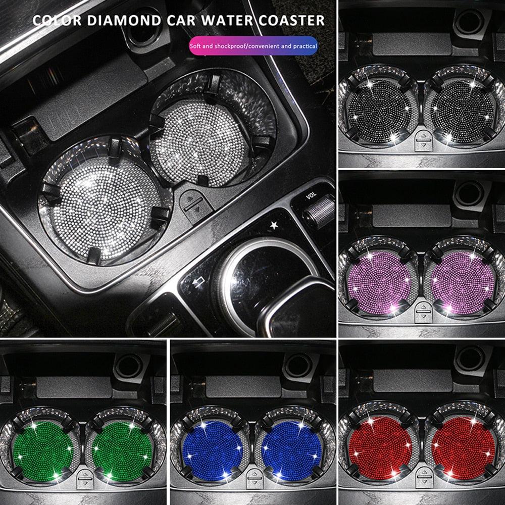 Set of two glamorous diamond-patterned rhinestone car cup holder coasters in a vehicle.