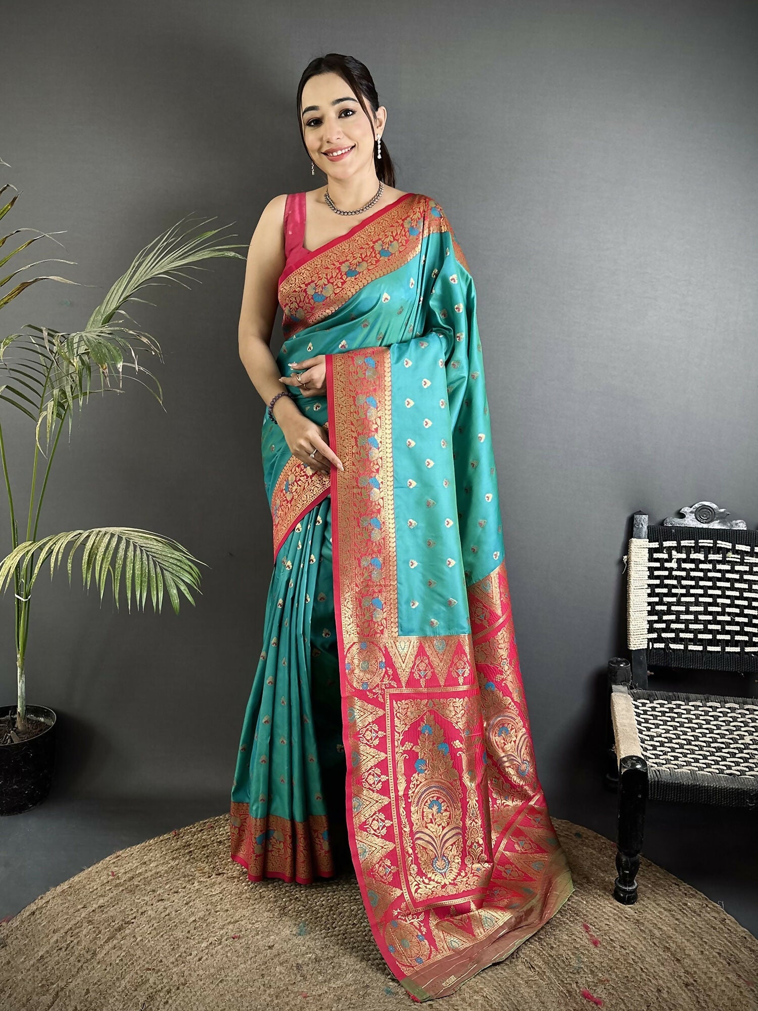 Teal Blue Soft Silk Banarasi Saree with traditional intricate motifs and matching blouse fabric.