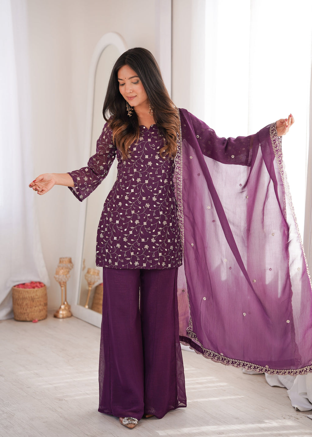 Wine-colored Crunchy Silk kurta set with embroidery and Jari work, featuring bell-bottom pants and a matching dupatta.