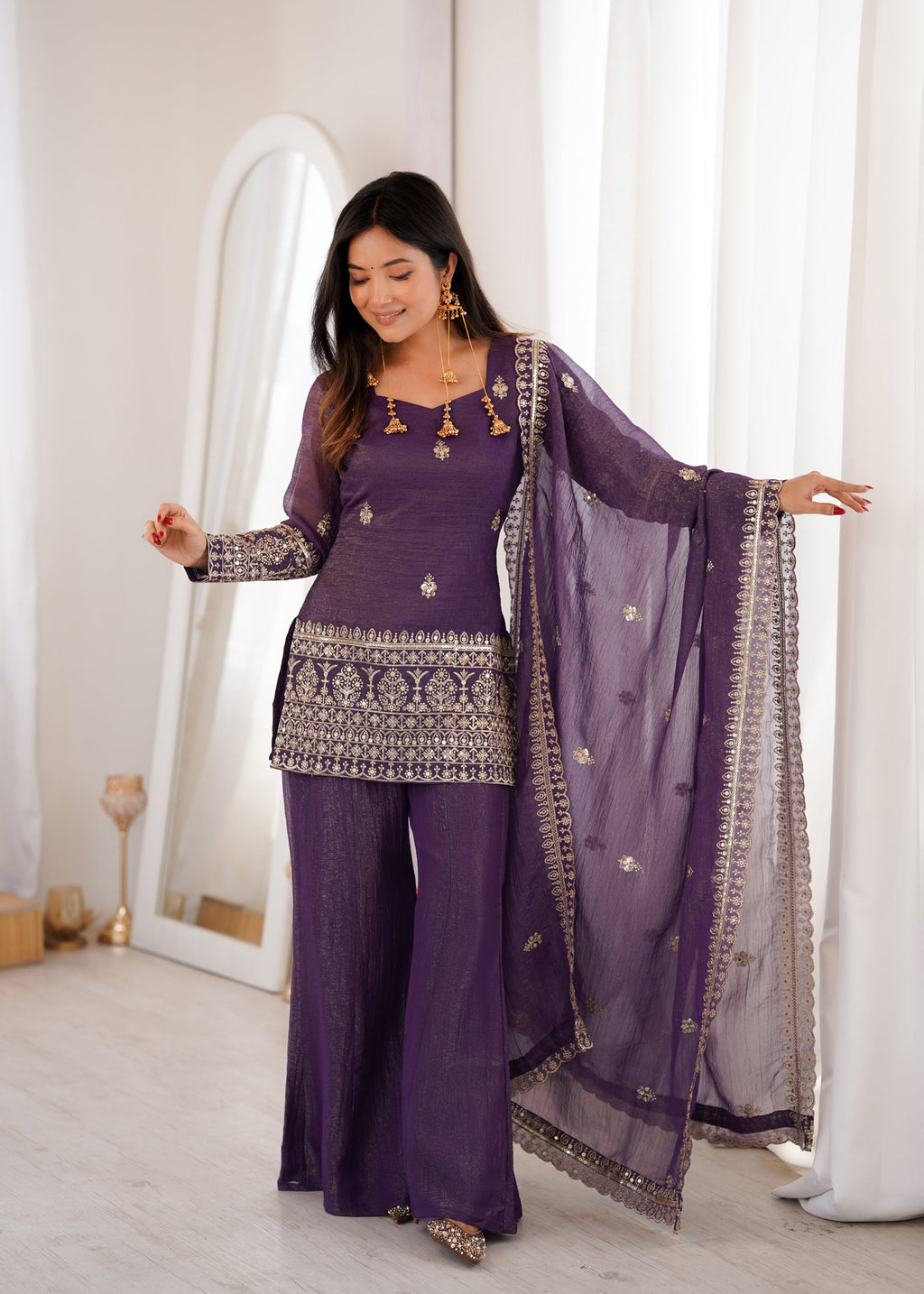 Purple crunchy silk kurta set with embroidery and jari work paired with bell bottom pants and a dupatta