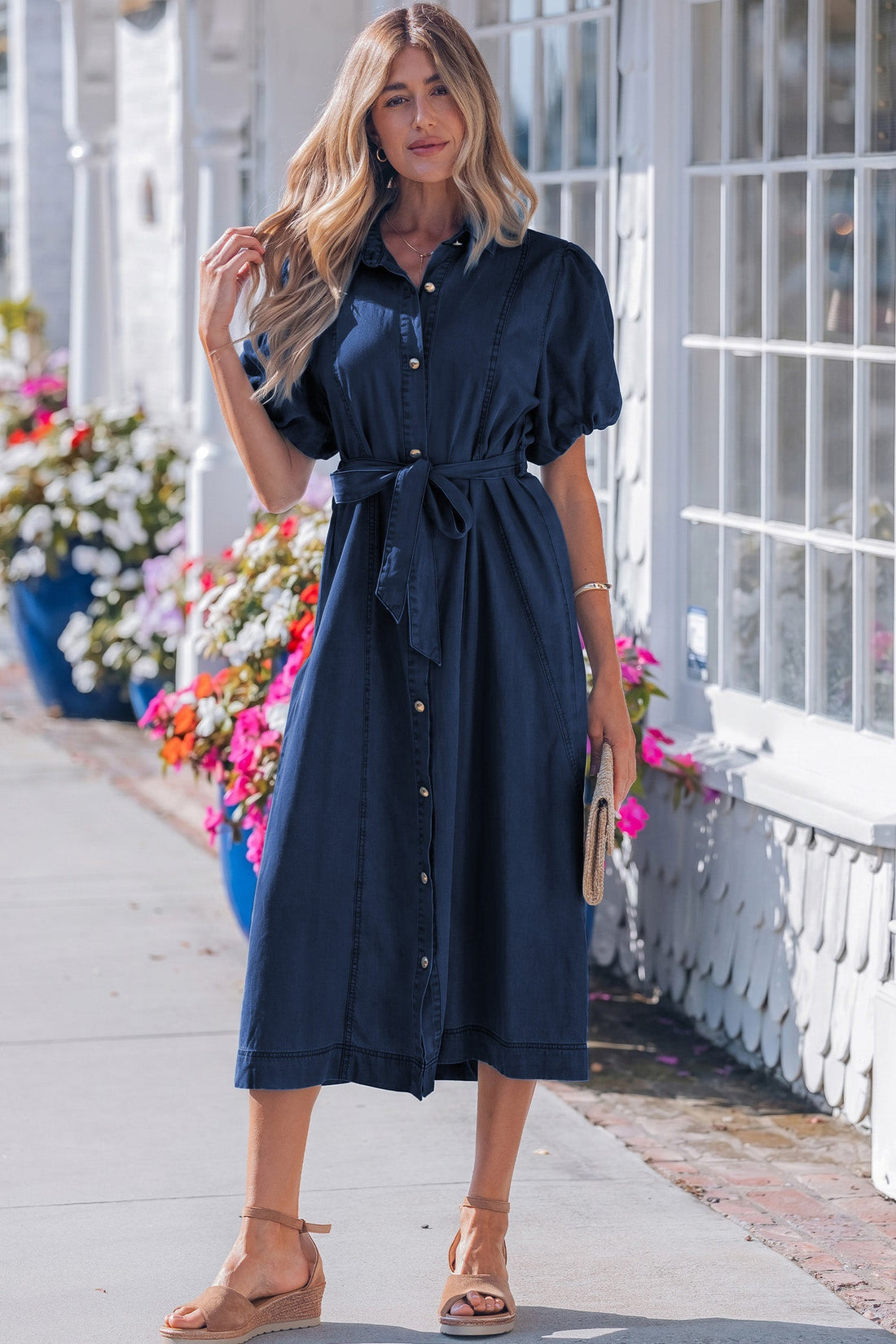 Woman wearing Makayla bubble sleeve dark blue denim button-down midi dress