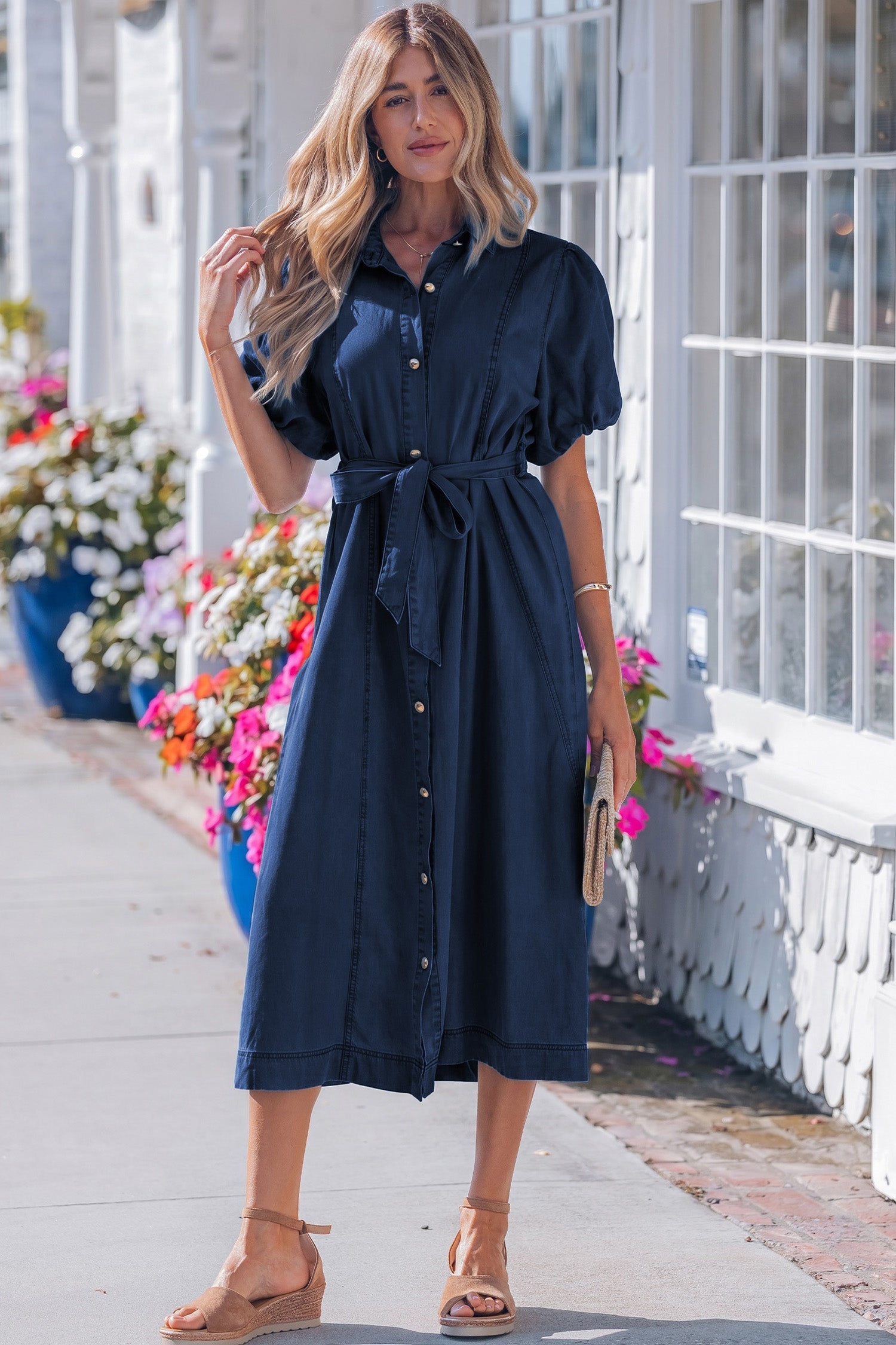 Woman wearing Makayla bubble sleeve dark blue denim button-down midi dress