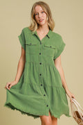 A stylish green denim button-down shirt dress with a collared neckline and relaxed fit.