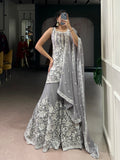 Woman wearing a Star Georgette Kurta Palazzo set with sequins and thread embroidery work