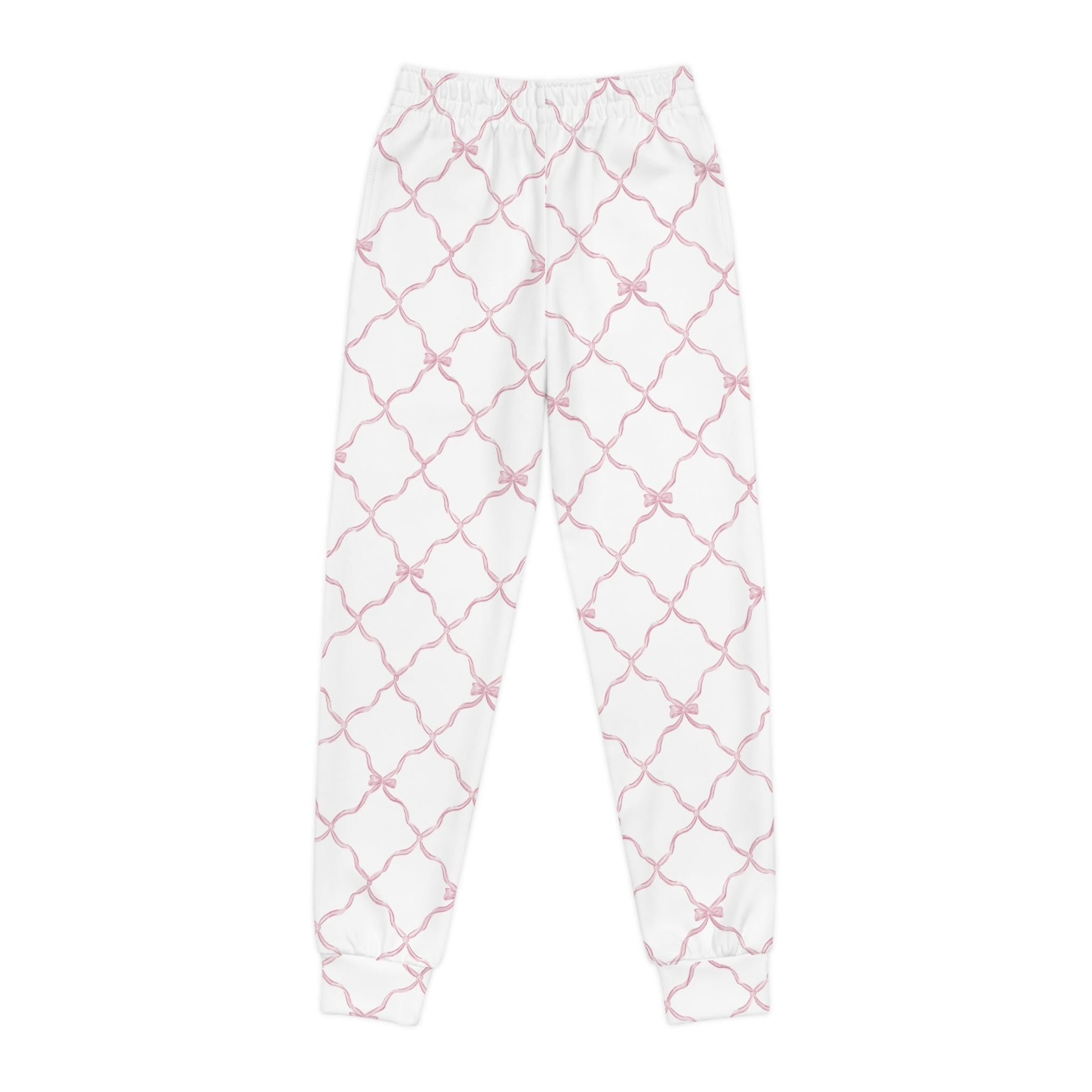 A pair of white youth joggers featuring a pink trellis and bow print pattern on a white background, viewed from front and side profiles.