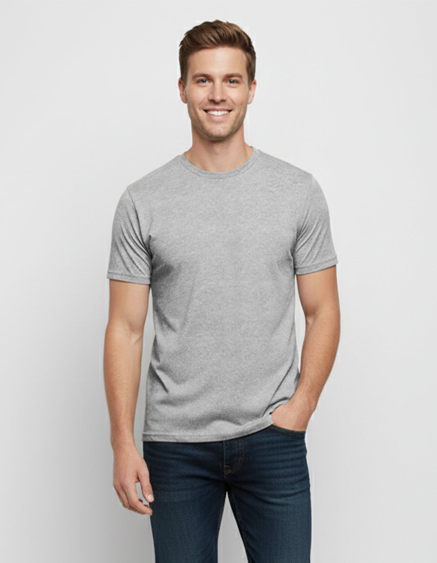 A man wearing a grey crew neck short sleeve cotton t-shirt with jeans.