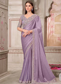 Beautiful lavender traditional wedding saree featuring delicate embroidery and an unstitched blouse