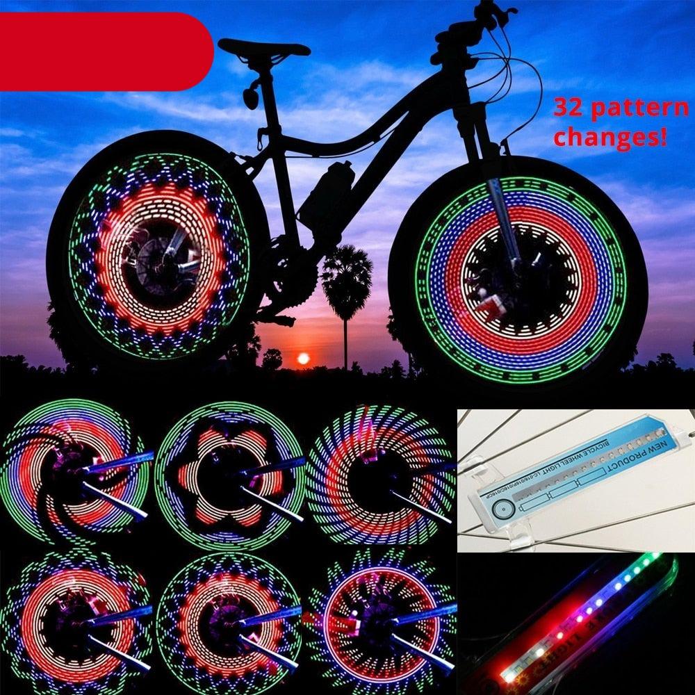 32 RGB LED bicycle wheel light showing dynamic light patterns on a spinning bike tire at night.