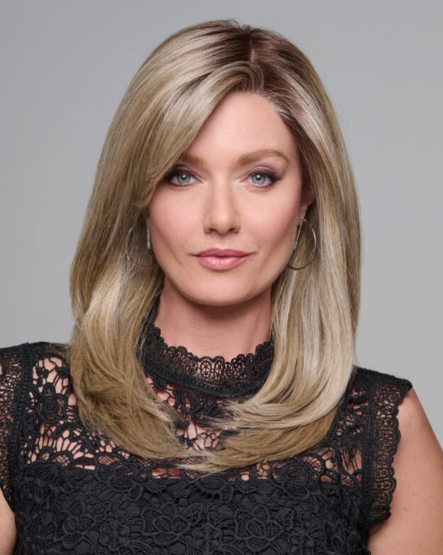 Woman wearing the Raquel Welch Dress Rehearsal wig in a sophisticated blonde shade